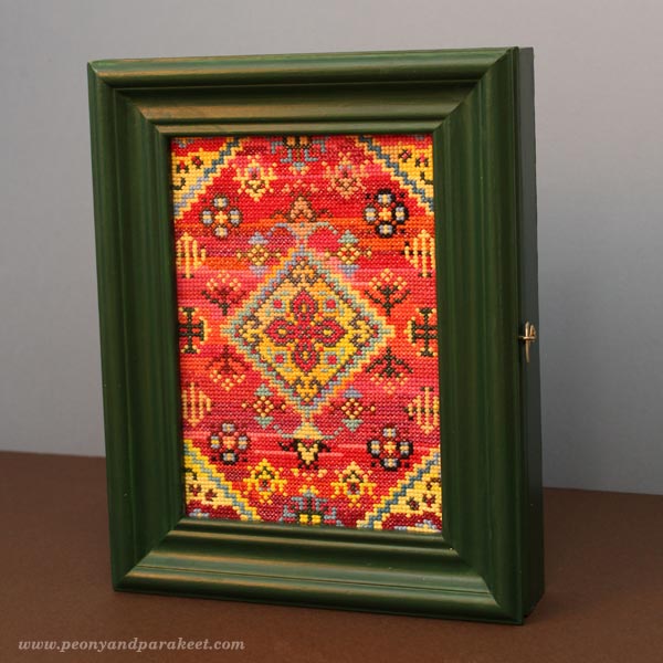 Key storage cabinet with a cross stitch cover using leftover flosses. By Peony and Parakeet.