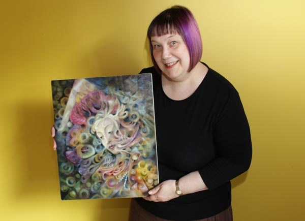 Paivi Eerola and her oil painting Heaven and Earth.