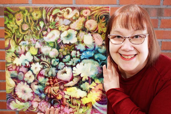 Artist Paivi Eerola of Peony and Parakeet and her oil painting in progress.