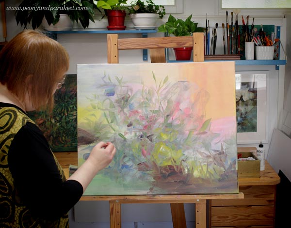 Artist Paivi Eerola and her painting in progress.