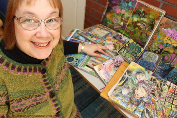 Paivi Eerola and her many art journals.