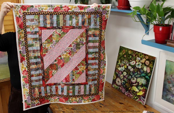 A dog quilt by Paivi Eerola of Peony and Parakeet. Read her thoughts about crating and art-making, craft artists, fine artists, and crafters.