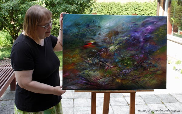 Paivi Eerola and her oil painting "All In"