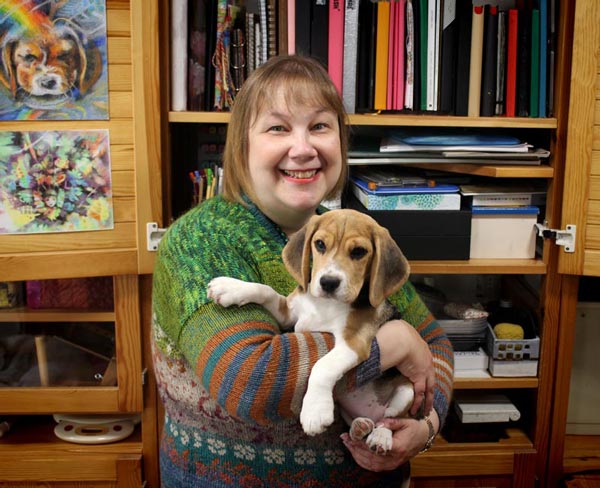 Paivi Eerola in her studio with her puppy Saima.