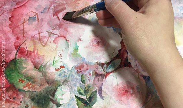 Painting flowers using a flat watercolor brush.